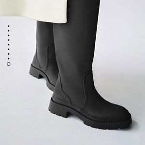 Zara low heel rubberized boots